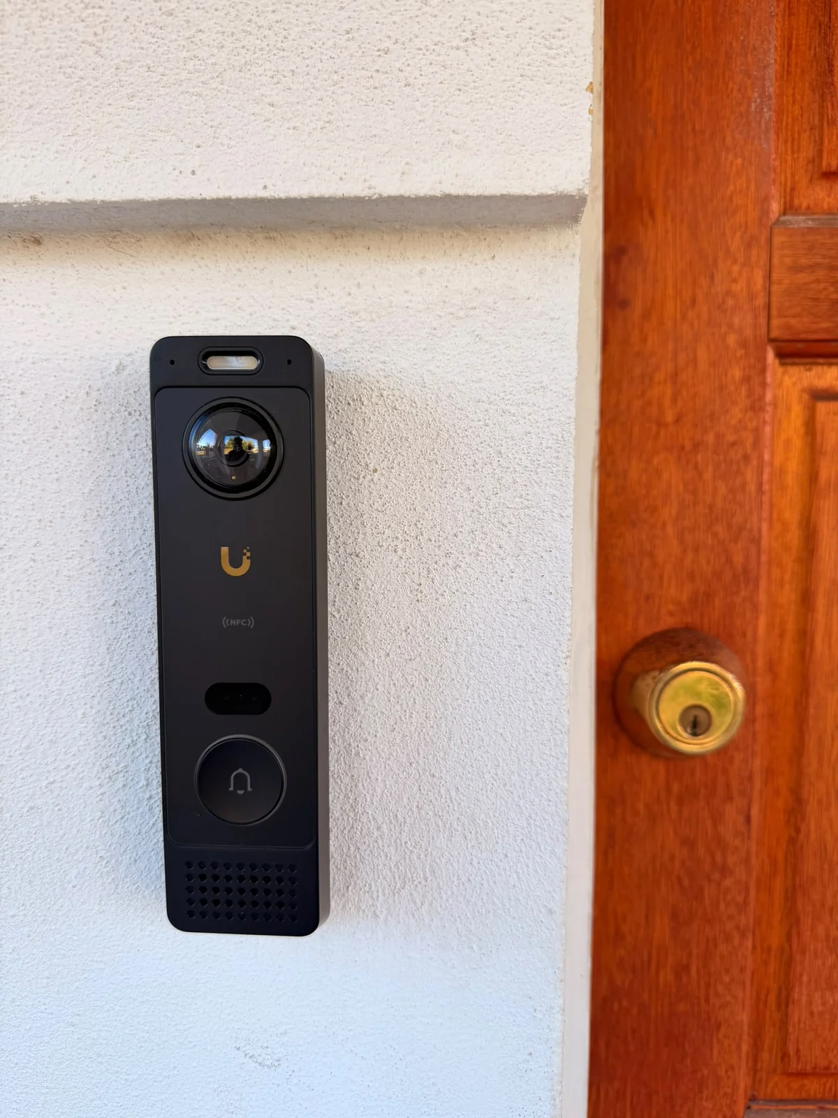 UniFi video doorbell installed beside the front door at the Waikiki home